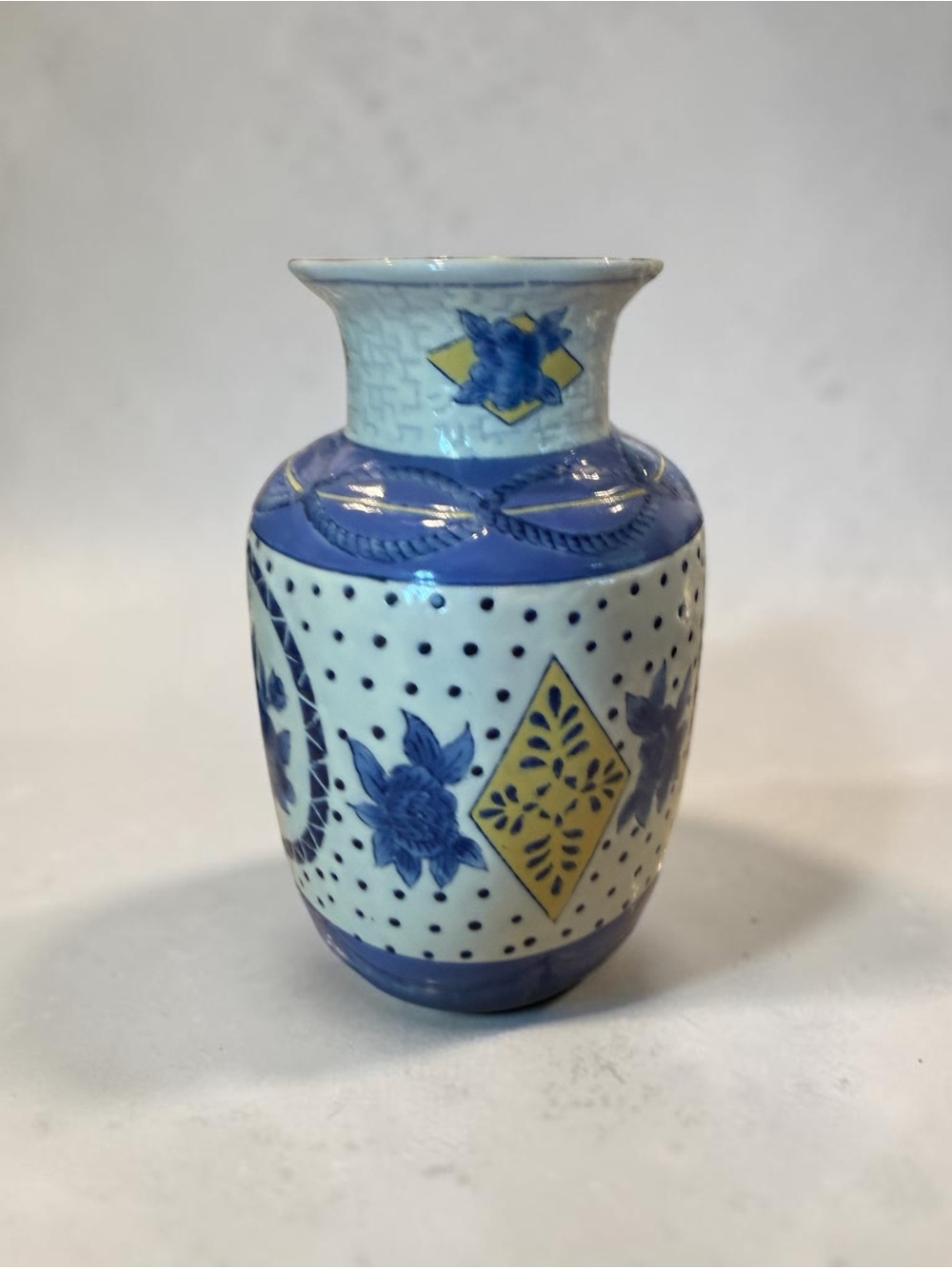 Vintage Porcelain Vase with Blue and White Floral Motif and Yellow Accents